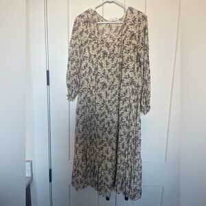 Carly Jean dress size small. Cream with blue and brown floral pattern